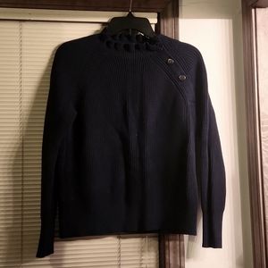 Just don't wear it. Too many sweaters